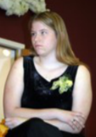 Lacey, sitting on chair at 2004 STF reception, looking to her right.
