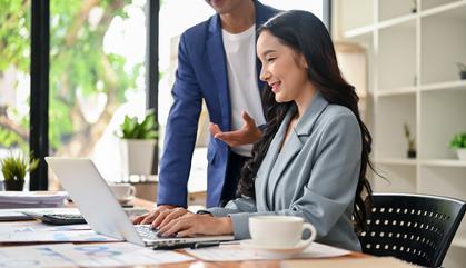 Young executive working with laptop