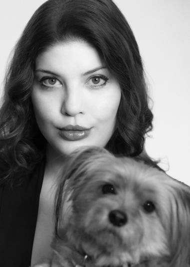 Black and white photo of spinto soprano Megan Marie Hart with her Morkie dog Maggie Moo Hart. Both are looking into the camera.