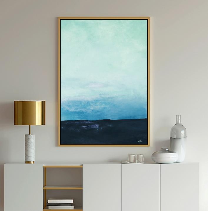 Blue Art ocean seascape in light blue and navy shows calm ocean water and clouds in the sky.