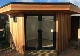 Small cedar clad garden office in Epping built by Robertson Garden Rooms