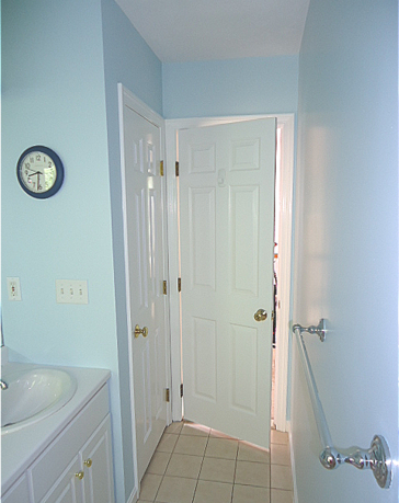 2nd floor bathroom painted with light blue walls.