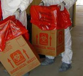 Hazmat Cleanup crew dressed in PPE disposing of biohazard waste caused by an unattended death.