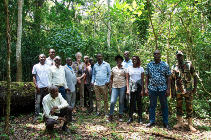 Delegation posing in front of mama Mutere, a fallen 300 year old tree that once served as a shrine where locals prayed for rain and good harvest.