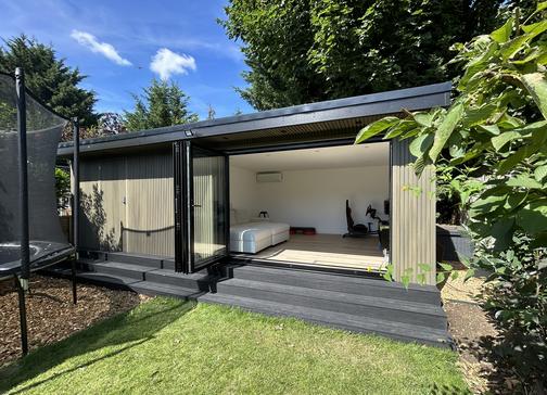 Large modern garden room with pool table and bar