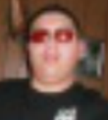 Head-shot of Lucas, wearing sunglasses.
