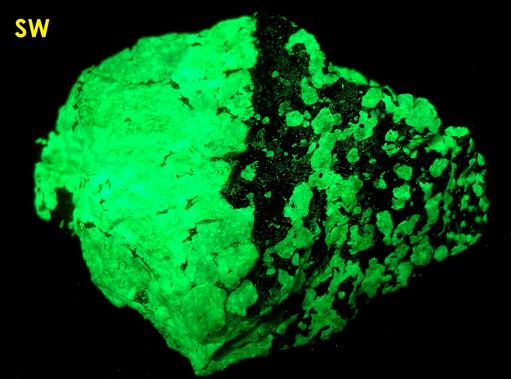 SW LW fluorescent Willemite, red Zincite, black Franklinite - Franklin Mine, Franklin, Franklin Mining District, Sussex County, New Jersey, USA - type locality