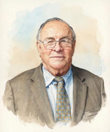 Watercolor portrait of Dr. Joseph Nussbaumer, Jr, Federal Association of Christian Counselors and Therapists licensed Christian Psychologist, with short gray hair and wire-rimmed glasses, wearing a brown suit jacket, light blue collared shirt, and a patterned tie in shades of blue and gold. He has a gentle, slight smile and is looking directly at the viewer. The artwork features soft, blended watercolor washes in beige and blue tones around his shoulders against a light background.