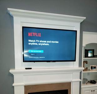 TV mounted over fireplace, tv mounting service in Charlotte NC, Carolina Custom Mounts