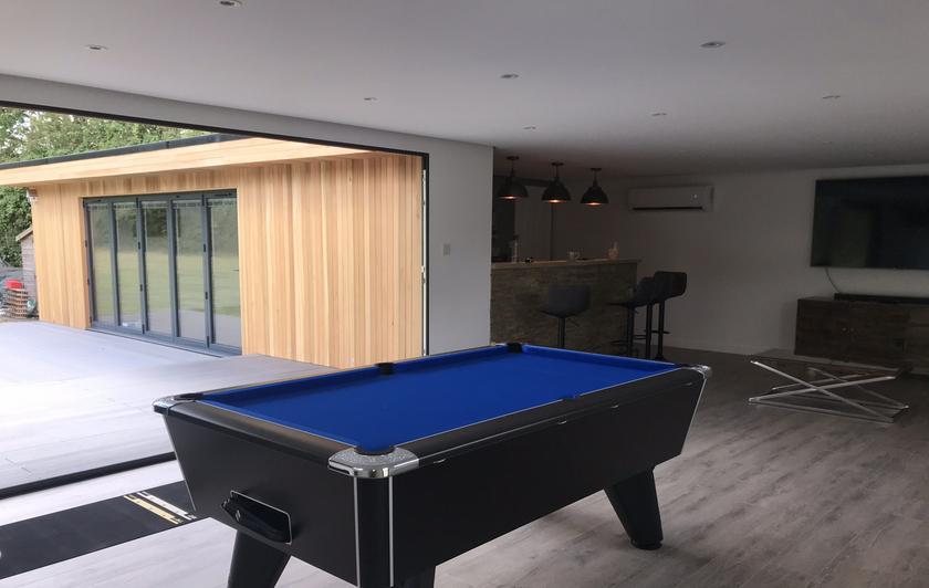 Large modern garden room with pool table and bar