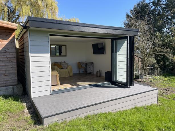 Large modern garden room with pool table and bar