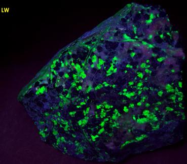 phosphorescent fluorescent WILLEMITE, HYDROZINCITE, CALCITE, ZINCITE, FRANKLINITE - Sterling Mine, Sterling Hill, Ogdensburg, Franklin Mining District, Sussex County, New Jersey, USA - Zincite and Franklinite type locality