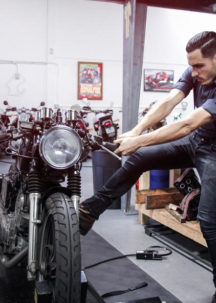 custom motorcycle man at work