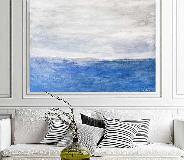 Blue Art ocean seascape in light blue and white which shows calm ocean water and clouds in the sky.