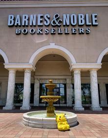 Barnes & Noble front with a fountain and Pikachu