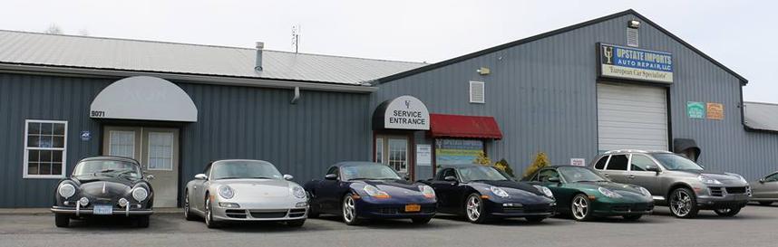 Modern and classic Porsche vehicles outside of Auto Imports in Syracuse, NY