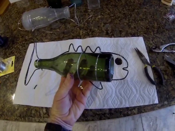 How to make DIY Hanging Bottle Fish Art from any old bottle and some wire. www.DIYeasycrafts.com