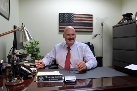 LT Tommy Potter sitting at his desk