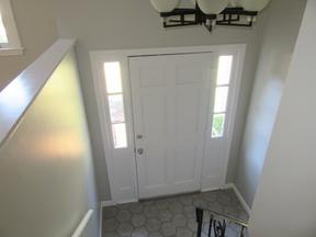 Front entry door painted white.