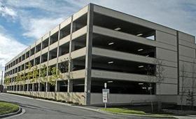 Commercial parking garage structure featuring expansion joints and waterproofing systems