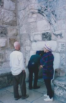 Mab stooping to enter needle gate in Bethlehem