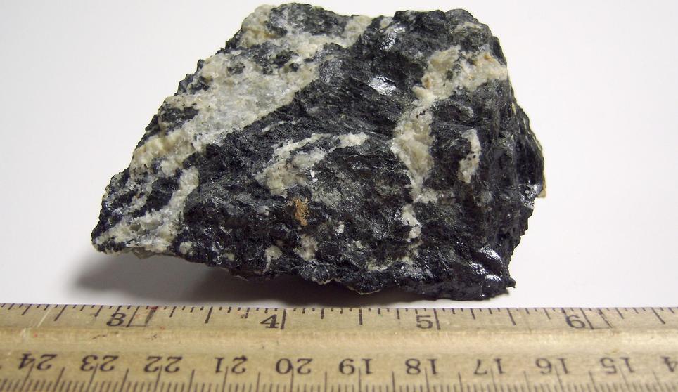 MAGNESIO-HORNBLENDE and fluorescent ALBITE, Philips Mine (Philips Pyrite Mine; Anthony's Nose Pyrrhotite Mine), Anthony's Nose, Philipstown Township, Putnam County, New York, USA