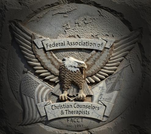A stone engraving of the FACT emblem featuring an American Bald Eagle holding an American Flag and a Christian Flag with a banner at the top stating Federal Association of and a banner at the bottom stating Christian Counselors & Therapists. Under the bottom banner is FACCT 1993.