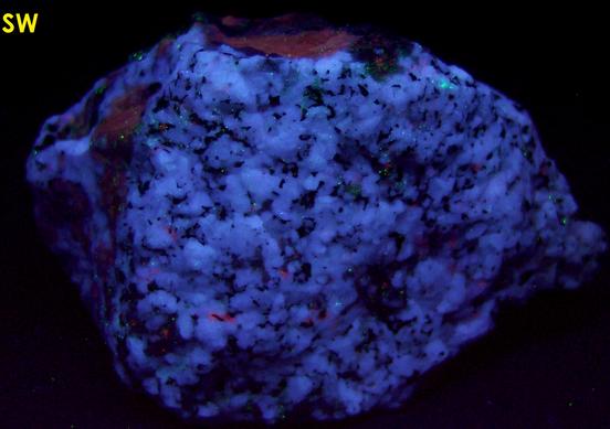 fluorescent SCAPOLITE, CORUNDUM SAPPHIRE, PLAGIOCLASE ALBITE ANORTHITE, BIOTITE -York River area, Dungannon Township, Hastings County, Ontario, Canada