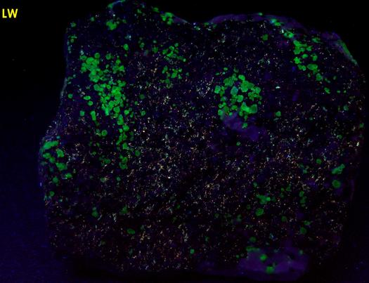 FRANKLINITE, fluorescent ZINCITE, SPHALERITE, WILLEMITE, HYDROZINCITE, CALCITE - Sterling Mine, Sterling Hill, Ogdensburg, Franklin Mining District, Sussex County, New Jersey, USA – type locality