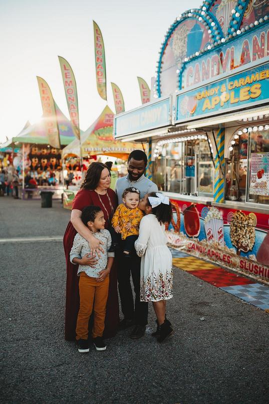 Family lovingly posed at the Coastal Carolina Fair.