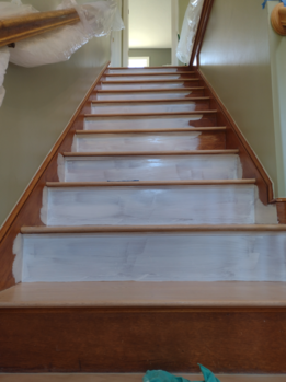 Priming stairway, risers and skirtboards.