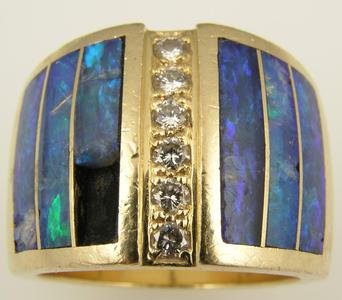 Opal ring in need of repair. Many broken pieces of opal.