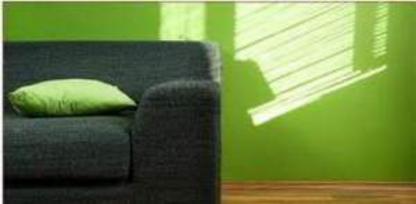 green painted walls with couch.