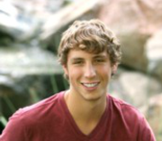 Outdoor picture of Brandon smiling at camera
