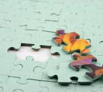 Graphic of incomplete green puzzle symbolizing progress and growth.