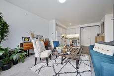 Living room with kitchen in background