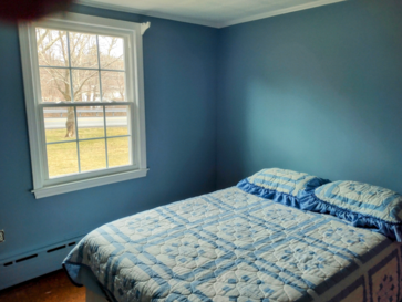 Blue painted bedroom walls.