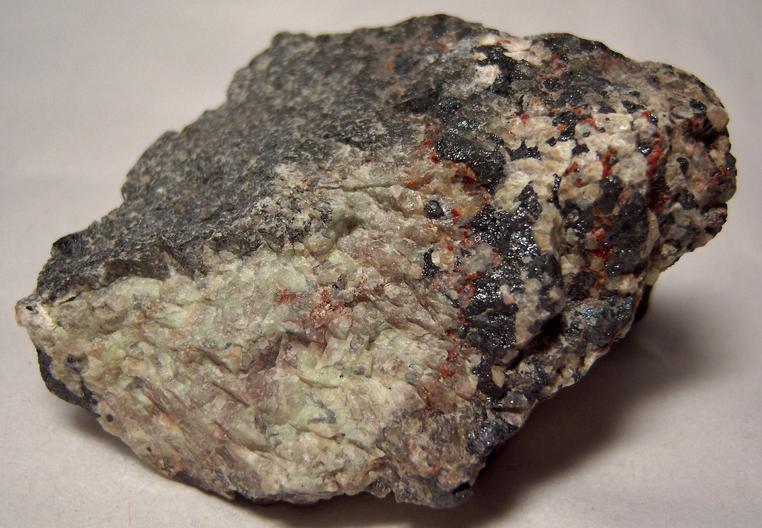 SW LW fluorescent Willemite, red Zincite, black Franklinite - Franklin Mine, Franklin, Franklin Mining District, Sussex County, New Jersey, USA - type locality - for sale