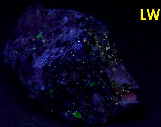Black Franklinite, red Zincite, white Hydrozincite, green fluorescent Willemite, white Calcite - Sterling Mine, Sterling Hill, Ogdensburg, Franklin Mining District, Sussex County, New Jersey, USA