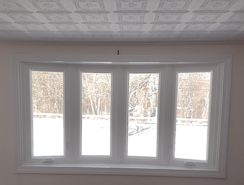 Bay window painted a white semi-gloss.