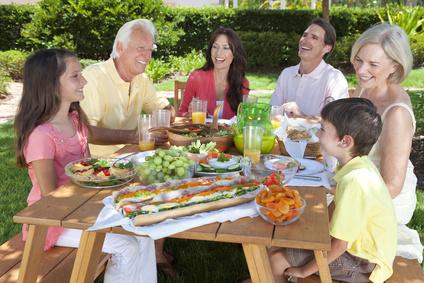 Happy family eating healthy foods together