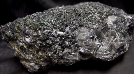 fluorescent WOLLASTONITE, GARNET, PYRITE, DIOPSIDE, black CALCITE - Sterling Mine, Sterling Hill, Ogdensburg, Franklin Mining District, Sussex County, New Jersey, USA
