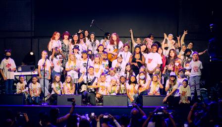 Fifty girls on stage at the House of Blues singing