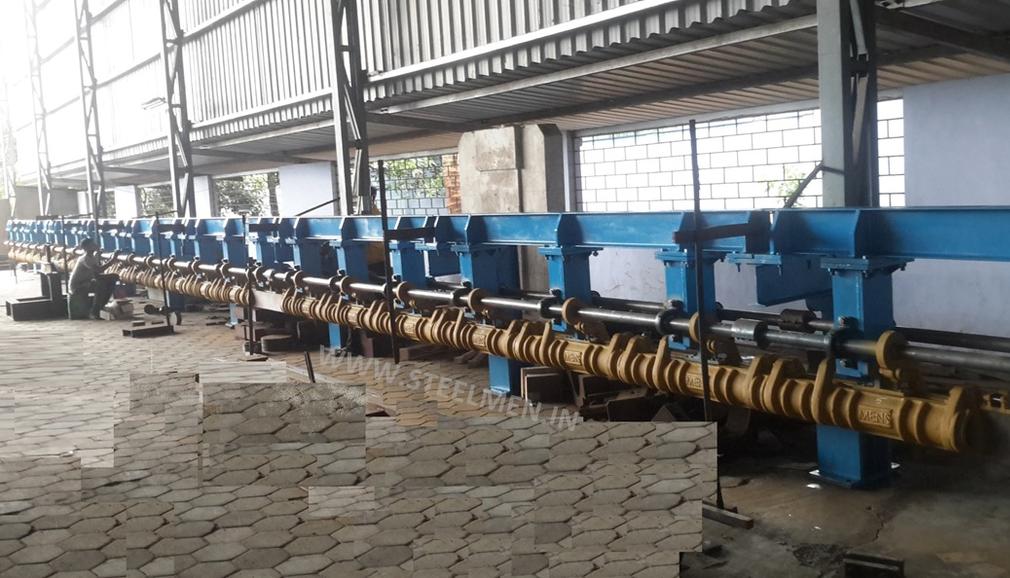 Y-TABLE FOR ROLLING MILLS, OIL LUBRICATION SYSTEM (Capacity - 50 LPM to 300 LPM), AUTOMATIC BUNDLING MACHINE, Hot Billet Shear, Billet Charging Grate, Flywheel, Gear Boxes, Mill Stands, Shearing Machines, Conveyor Rolls, Spindle Carrier, Pinch Rolls, Tilting Tables, Twin Channel, TMT Quenching System, Tail Breaker Pinch Rolls, Oil Lubrication System, Guide Box & Twist Pipes Mechanical Pusher, Mill Accessories, TMT Chain Transfer System, Recuperators, Cooling Tower, gear coupling, universal spindles, steel rolling mill, rolling mill items, steel plant machineries, steel plants, CCM, Continuous casting machine, steel melting, steel makers, leju Thomas, 9310524787, Gear boxes, Pinion stands, Rolling mill Stands on Fiber& bearings, Roller tables, Tilting tables, Y tables, Guide boxes, Chocks, Couplings, Spindles, Rotary shears, Flying shears, Cantilever type pinch Rolls, Tail Breaker pinch Rolls, Quenching Systems (for 8-16 mm, 16-25 mm, & 25-32 mm), Twin channel, Hot Rolling Mills, Shears, Automatic Cooling Bed, Quenching Boxes, Twin Channel Machine, Mill Stands, Cold Rolling Mills, Gear Couplings, Industrial Gear Box, Punching Cropping Machine, Hot Saw, Transmission Tower Machinery, Chain Transfer Systems, Product Design Development, Hot Rolling Mills Bar Rolling Mill Hot Rolling Mill Equipment Slit Rolling Mill Shears Flying Shear Crank Shear Continuous Rotating Shear Disc & Drum Shear Automatic Cooling Bed Quenching Boxes TMT Quenching Boxes Twin Channel Machine Industrial Gear Box Helical Gear Box Rolling Mill Gear Boxes Mill Stands Rolling Mill Stands TMT Mill Stands Housingless Mill Stands Cold Rolling Mills Gear Couplings Gear Jobwork Punching Cropping Machine Hot Saw Traveling type Hot Saw Fixed type Hot Saw Transmission Tower Machinery Chain Transfer Systems Product Design Development, Turnkey Solutions For Hot Rolling Mills Coilers Mill stands Shears & hot saws Twin channel Cooling beds Gear boxes & pinion stands TMT Equipment, Rolling Mill Machines Blade Grinding Machine Hot Saw Machines Straightening Machine Hydraulic Pusher, Hydraulic Cylinders, Ejectors, Hot Rolling Mill Flywheels Gear Boxes Mill Stands Gear Couplings Material Handling Equipment TMT Equipment Cooling Bed Shearing Machines Straightening Machines Spare Parts Of Rolling Mills Other Allied Equipments Bending & Time Machine Workshop Machinery, ♦ Bar Mills ♦ Structural Steel Mill Wire Rod Mill with Bar in Coil Line Rolling Mill for High-Grade Steels Section Mill High Speed Laying Head with Gear Box Crank Lever Shears Crank Shears Housingless Stands Double Crank Shears Rake Type Cooling Conventional Mill Stands Gear Boxes Rod mill block Varioblock Flying Shear • Tail Braking Pinch Roll • Cold Shear, Starting Stock Billets 160 x 160 x 12,000 mm 130 x 130 x 12,000 mm Furnace Group Charging grate, Hot charging, Elevator, Induction online heater Finished product Rebar 8 three-strand slit TMT Rebar 10 two-strand slit TMT Rebar 12-40 mm TMT Flats, angles and channels are possible too Sub-bundles 100-400 kg Master bundles 1 MT-3 MT Furnace Capacity 80 MT/h Main train Single-strand H/V arrangement, two strands are H/V type Roughing train : 4 off Model 600, 2 off Model 440, Free outlet after stand # 2 Intermediate train : 4 off Model 440, 4 off Model 340 Finishing train : 6 x Model 340 Associated shears Loopers : 8 off vertical, 6 off Single strand, 2 off multi strand Capacity 400,000 MT/y Cooling bed group Water quenching line, Thermex Cooling bed shear Cooling bed 66 x 10 m Finished speed 16 m/s (20 m/s) Material grades Carbon steels, Alloyed Structural Steel grades Continuous finishing shop Stationary cold shear 3,000 kN Counting system Small bundle forming 4 off Tying machine Various associated equipment, e.g. stoppers, chain transfers, roller tables, Starting stock Blooms 180 x 180 x 8,000 - 12,000 mm 300 x 300 x 8,000 - 12,000 mm Finished product Rebars 28 - 40 mm Rounds 30 - 100 mm dia. Hexagons 50 - 80 mm Flats 8 x 30 - 60 x 150 H-Beams 100 - 180 mm I-Beams 100 - 200 mm T-sections 75 - 140 mm Channels 100 - 200 mm Angles 80 x 80 x - 200 x 200 mm U-type sections for mine timbering 18U, 25U,29U Bundle/stack length 6 - 24 m Bundle/stack weight 2 - 5 t Furnace capacity 116/143 t/h Annual capacity 700,000 t/y Finishing speeds 6 m/s Material grades Carbon steels, Alloyed structural steel,Antifriction bearing steel Furnace group: Elevator (for hot charging), charging grate,weighscale, descaler, insulated holding tunnel Mill train: Single strand Roughing train 4 x Model 670, 1 x Model 760(V-H-HV-H) Intermediate train: 2 x Model 760, 4 x Model 670(H-H-H-UR-UR-HV) Finishing train: 5 x Model 670 (UR-HV-UR-HV-FUR) Associated shears Loopers: 4 x vertical Cooling bed group: Water cooling line, pinch roll unit Cooling bed shear Cooling bed 84 x 19 m Short-bar collecting device Continuous finishing shop In-line straightening machine (10 rollers) Hot saws: 1 x stationary, 1 x movable Abrasive cutting machines: 1 x fixed, 1 x movable Piling and stacking facilities (magnet-type) Tying machines: 2 x stationary, 2 x movable Various associated equipment, e.g. stoppers, chain transfers, roller tables. upto 150 x 150 x 12,000 mm Finished product: Wire rod 5.5 - 16 mm Rebars Nos. 3, 4 and 5 (as per ASTM) Coils 16 - 42 mm dia. Furnace capacity: 70 t/h Annual capacity: 300,000 t/y Finishing speeds: Wire rod line - 100 (120) m/s Bar in coil line - 13.5 m/s Material grades: Cold-heading steels Reinforcing steels Steels with a carbon content from low to medium Piano-wire PC-wire Free-cutting steel Water cooling line, pinch roll units, bar reels (2x), coil transfer,chain conveyor with retarded and accelerated cooling facilities, transfer unit to Power & Free coil handling system, Starting stock Billets 50 x 100 x 10,000 mm 125 x 125 x 11,400 mm Finished product Rod 5.5 - 13.5 mm dia. Bars 11 - 57 mm dia. Flads 22 - 120 mm, 5 - 12 mm thick Bundle/stack length 3 - 8.5 m Bundle/stack weight 0.5 - 3 (5) t Furnace capacity up to 60 t/h Material grades High-grade structural steels 34 Cr 4, 60 SiMn7, 42 CrMo4 Antifriction bearing steels 100 Cr 6, 100 Cr 2, 100 CrMo 7 3 Material grades Tool steels X 210 Cr 12, X 38 CrMoV 5 1, 55 CrNiMoVS 4 2 4 Acid-resistant and heat-resistant steels X 5 CrNiMo 18 11, X 2 CrNiMo 19 13,X 20 CrNiSi 25 4 High-speed steels X 79 Wco 18 5, X 82 W Mo 6 5 5 Special alloys X 55 CrMnNiN 20 8,X 45 CrSi 9 3 X 3 CrNiMoNbN 23 17 The complete range of steel grades includes approx. 300 different grades Furnace group: Charging grate, cross transfers, weighscale, descaler (2x), heatholding tunnel Mill train: Single strand, H/V - arrangement Roughing train: PSW and 6 x Model 440 Intermediate train: 4 x Model 440, 2 x Model 340 Finishing train: 4 x Model 340 Kocks-block 8-stand wire rod block for high grade steels 3 x 215/ 5 x 170 Associated shears Loopers: 7 x vertical, 1 x horizontal Cooling bed group: Water cooling line, pinch roll unit Cooling bed shear Cooling bed 57 x 5 m Continuous finishing shop: Abrasive cutting machine Piling and stacking facilities (non-magnet type) Tying machines: 1 x fi xed, 1 x movable various associated equipment, e.g. stoppers, chain transfers, roller tables etc. Rod finishing equipment: Water cooling and equalizing sections, pinch roll unit,laying head Ring conveyor for retarded and accelerated cooling reforming tub Pallet-type coil handling system, compacting & tying units,weighscale, unloading station Reel plant Water cooling and equalizing sections, Pinch roll units, Bar reels: 2 x, Transfer equipment to pallet-type coil handling system, Omsairam Steel & Alloys Pvt. Ltd., Bhagyalaxml Rolling Mills Pvt. Ltd., Kalika Re-rollers Pvt. Ltd., Parvati Alloys (P) Ltd., MITC Rolling Mills (P) Ltd., Maharashtra Steel Rolling & Engg Co. Chimanlal Vijay Kumar Steels Pvt. Ltd, Bhagwati Ferro Metals (P) Ltd, Balbir Rolling Mills Ltd. Quartz Metals Inds., Metro Alloys Ltd., Pushpak Steel Inds. Pvt Ltd., T. k. Ispat Pvt Ltd., Allied Ferromelt Pvt Ltd., Bhagwati Steel Cast Ltd., R. L. Steels Ltd., Guardian Steels Pvt. Ltd., Shri Karvir Nivasini Mahalakshmi Ispat Pvt. Ltd., Khatu Shyamji Steel Rolling Mills Pvt. Ltd., Kunal Ispat & Alloy Inds. Pvt Ltd. Sun Metallics & Alloys Pvt. Ltd, Hans Ispat Ltd. Shri Khatu Shyam Industries, Rajuri Steel Pvt. Ltd, Shree Om Steel Rolling, Air Carrying Corpn (I) Ltd., titan Alloys Ltd. Sunflag Iron & Steel Co. Ltd., Sharda Ispat Ltd., Fortune Metaliks Ltd., Sharda Shree Ispat Ltd., R. K. Structures Pvt. Ltd., Sanvijay Industries Pvt. Ltd., Shivali Udyog (I) Ltd., S.D. Bansal Iron & Steel Pvt. Ltd., Inertia Iron & Steel Inds. Pvt. Ltd., Nalwa Steel & Power Ltd., Shilpa Re-rollers Ltd., Sri Jai Balaj Steel Rolling Mills Ltd., Petropol India Ltd. Galwalia Ispat Udyog Pvt. Ltd. Crest Steel & Power Pvt. Ltd. Himalayan Rolling Steel Industries Pvt. Ltd., Shree Balaji Pigments Pvt. Ltd., Upper India Steel Mfg. & Engg. Co. Ltd., Capital Ispat Ltd., Barnala Steels Inds. Ltd., Shri S.S. Shyam Steels Pvt. Ltd. Fortune Metals Ltd. Rathi Udyog Ltd., M/s. Gallantt Ispat Lyd., Gemini Merchandise Pvt. Ltd., Jagdamba Rolling Mills, Shree Krishna Steel Rolling (Jaipur) Ltd. Modi Steels, Usha Martin Inds. Prince TMT Steels Pvt. Ltd., Dindigul Iron & Steel Co (P) Ltd. ARS Metals Ltd. V.V. Iron & Steel Company Pvt Ltd. Jairaj Ispat Ltd., Pioneer Torsteel Mills (P) Ltd., Devshree Ispat Pvt. Ltd., Vaibhav Merchantile Ltd., Maa Mahamaya Inds. Pvt. Ltd., Chitrakoot Metal Ltd. P. R. Rolling Mills Pvt. Ltd. Shree Aravindh Steels Ltd. Shyam Steel Industries Ltd. Shri Ramrupai Balaji Steels Ltd. Adhunik Ispat Pvt. Ltd. Durgapur Steels Ltd. B. M. A. Stainless Ltd. Zion Steel Ltd. Shree Metaliks Ltd. Usha Martin Ltd. Shyam Sel Ltd. Maithan Steel & Power Ltd.