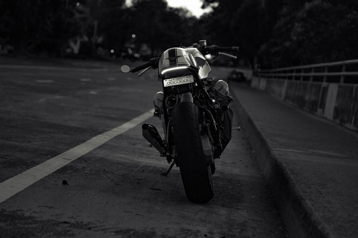 moto guzzi cafe racer at dawn black and white