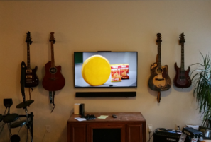 TV Wall mount installation and sound bar mounted below, carolina custom mounts