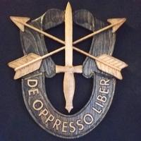 Wooden V-42 Crest
