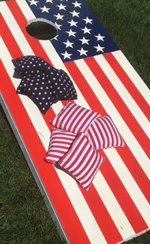 How to easily make an American Flag themed patriotic Corn Hole Yards game board set. FREE step by step instructions. www.DIYeasycrafts.com