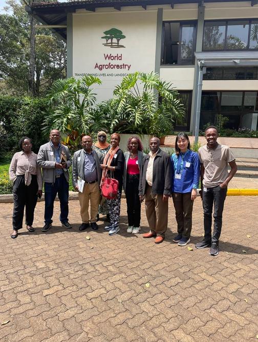 The delegations pose for a picture outside World Agroforestry Centre (ICRAF), with ICRAF staff, after a visit to the labs