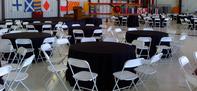 "Round table rental with white chairs for weddings and events